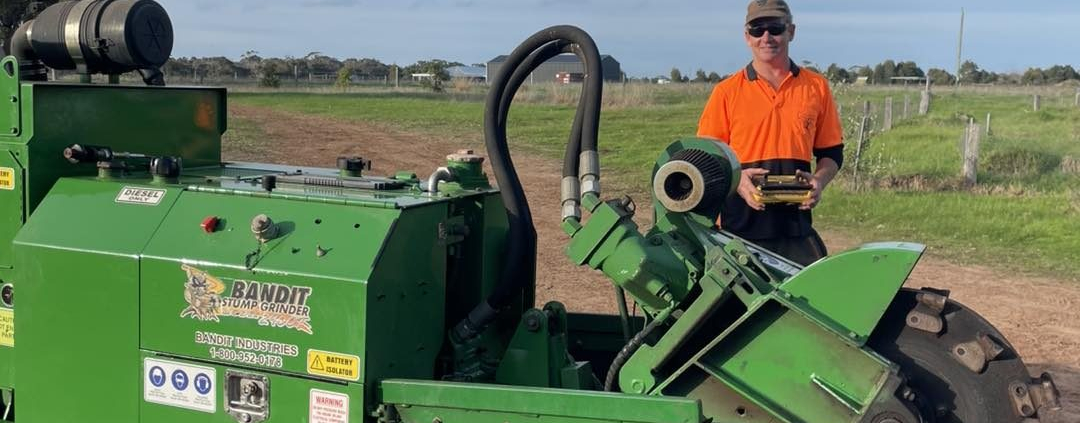 Stump grinding machinery removing a tree stump